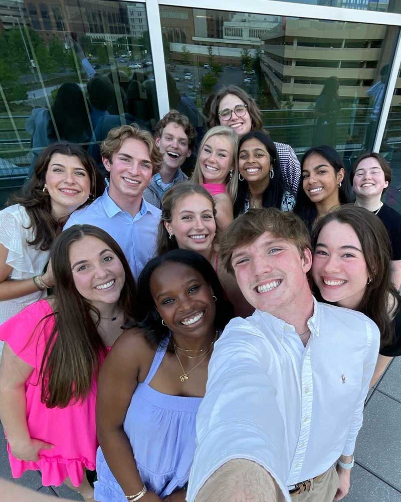 Group of Trailblazers taking a selfie outside.