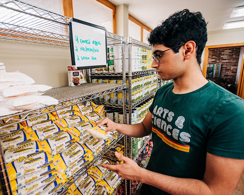 Student working in Blazer Kitchen pantry.