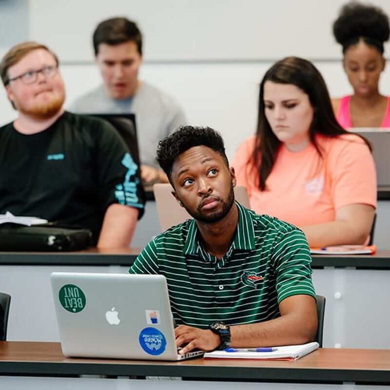 Students sitting in a Collat classroom. 