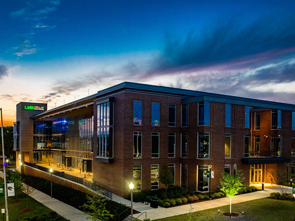 Collat School of Business building at sunset.