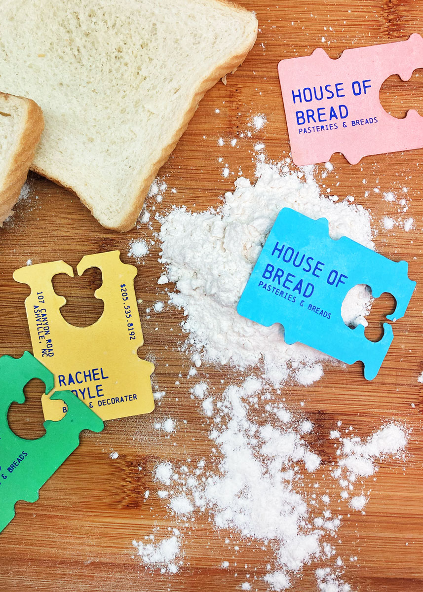 Busines cards in the shape of plastic bread ties.