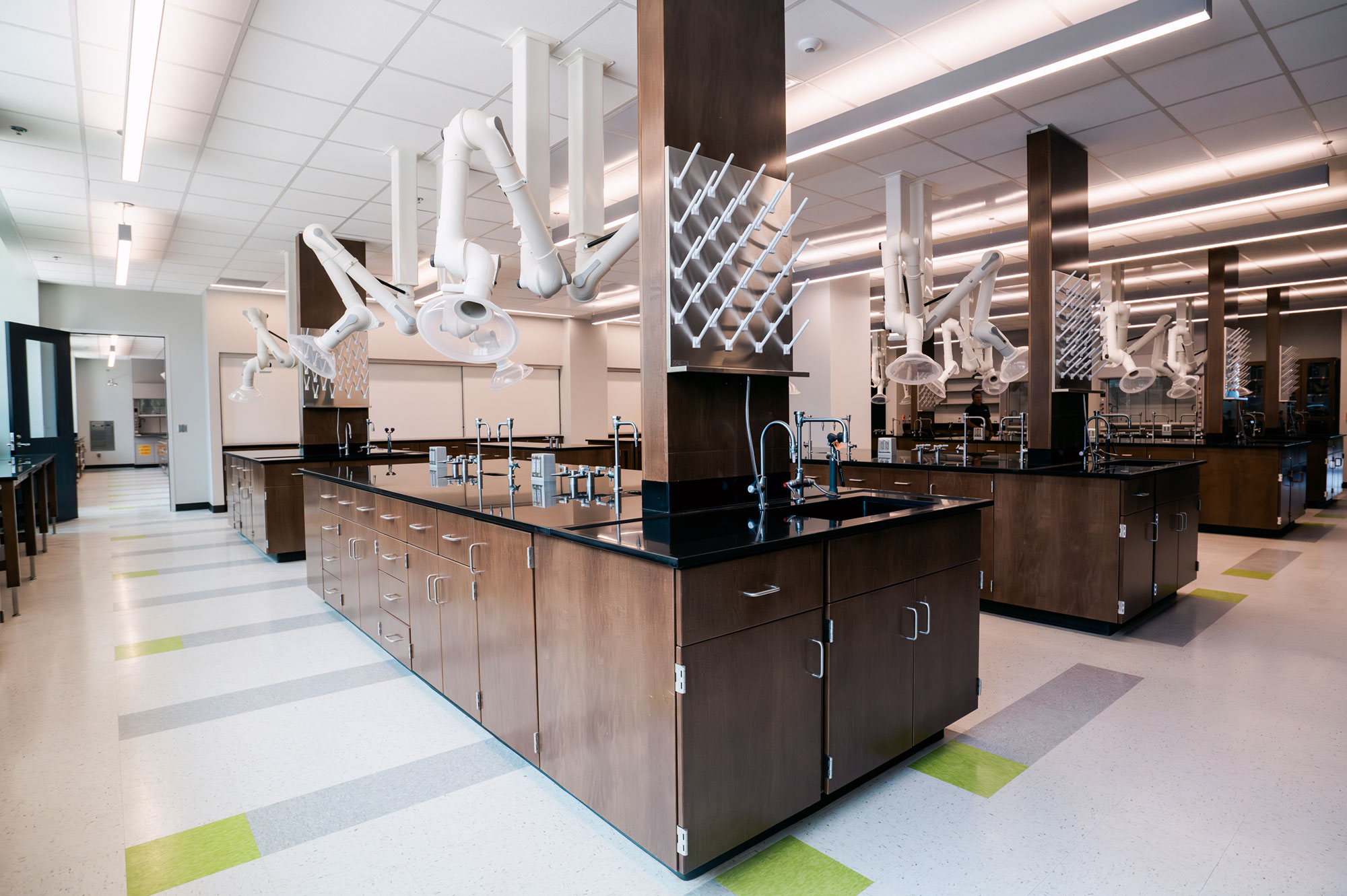 Interior of Science Hall, Science and Engineering Complex showing a laboratory equipped with exhaust snorkel dome hoods at each station