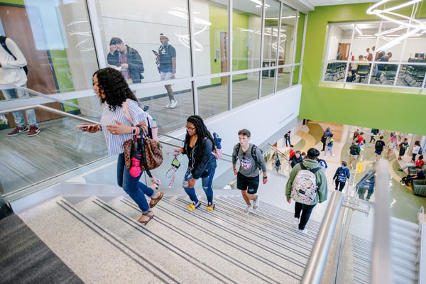 Students walking up stairs between classes.