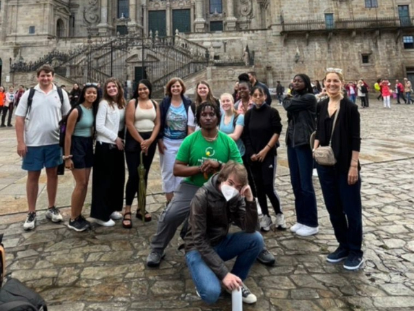 Photo of CAS students posing in front of a historical landmark