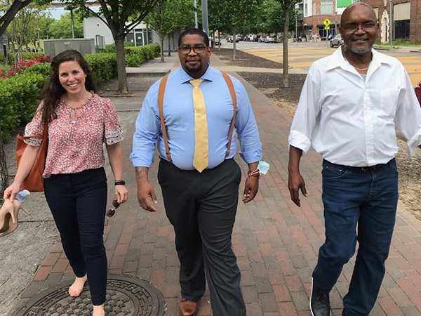 Alex LaGanke walking at Railroad Park with Ron McKeithen and Allen Slater.