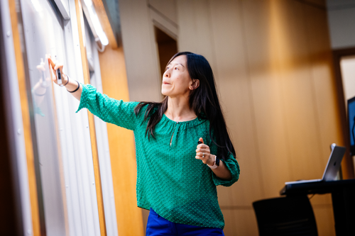 Xuan Huang Teaching Business Class in Collat School of Business 2022 2064x1376