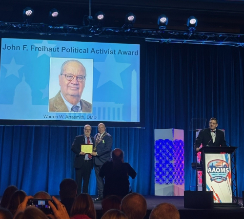Dr. Arrasmith receiving the AAOMS John F. Freihaut Political Activist Award at the AAOMS 2025 Annual Meeting.