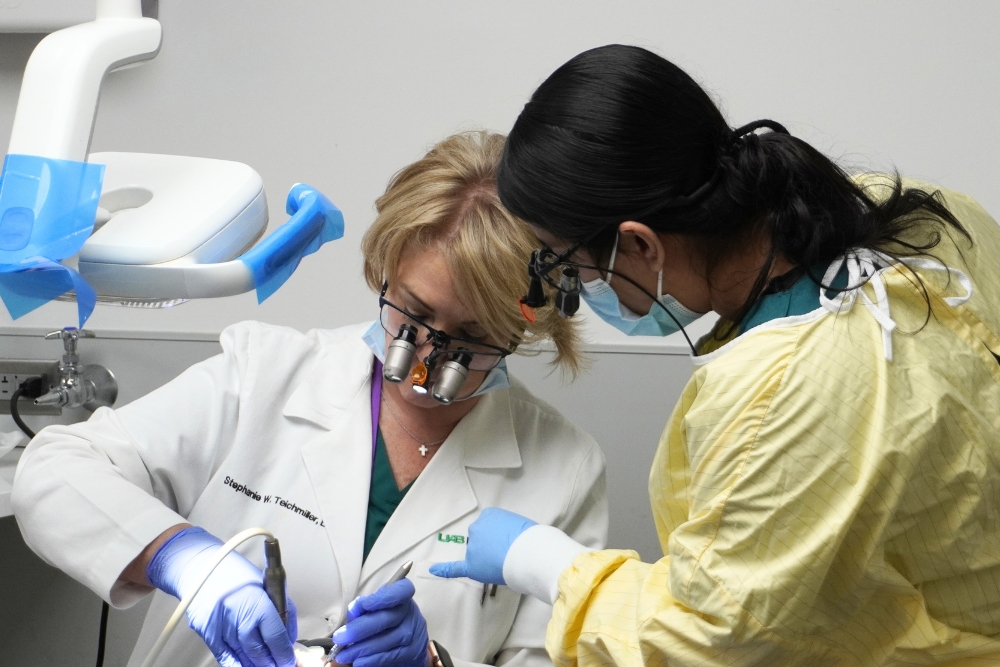 Student and Faculty working in clinic