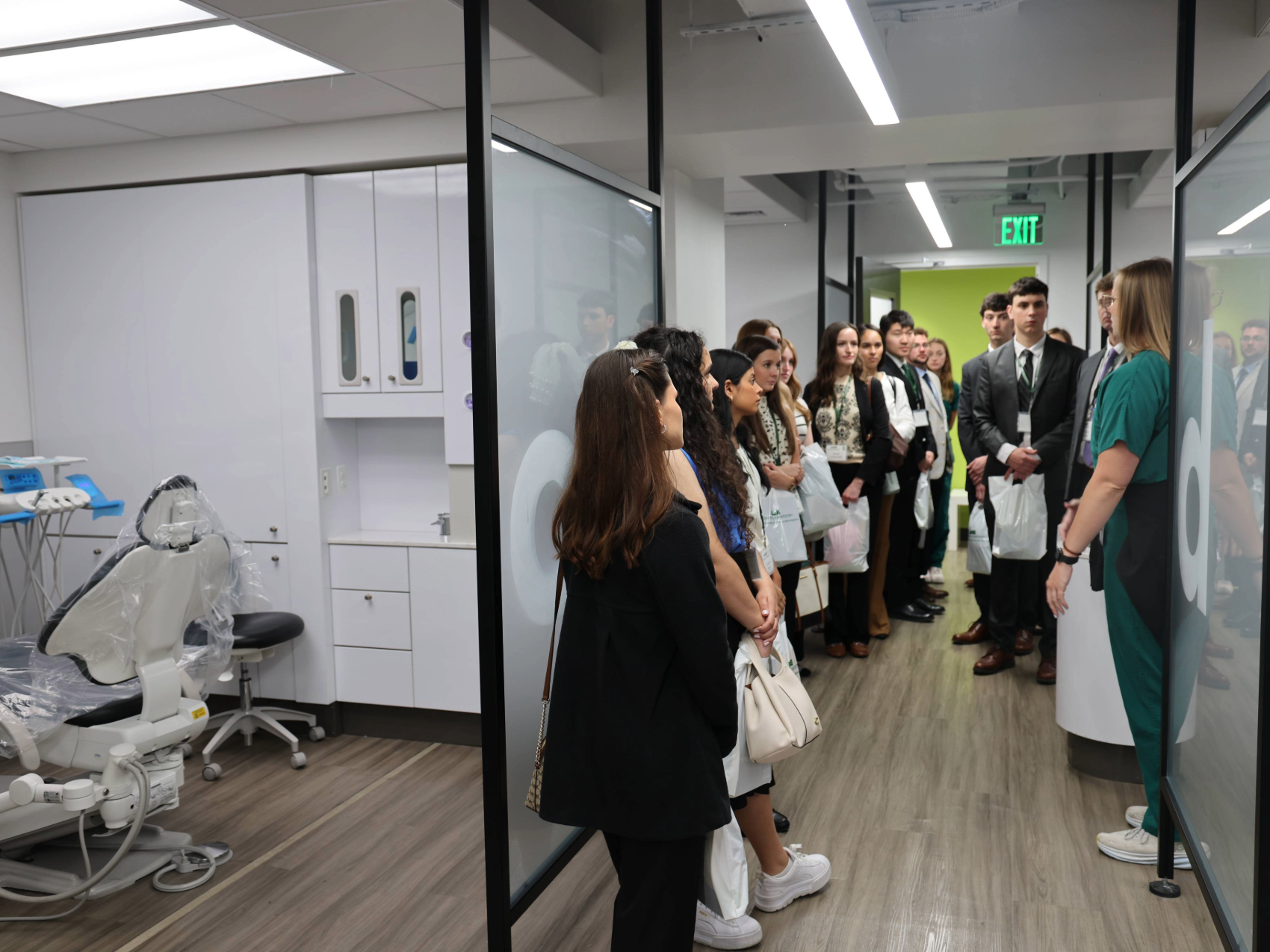 Incoming D1 students participating in clinic tour led by dental student on Welcome Day