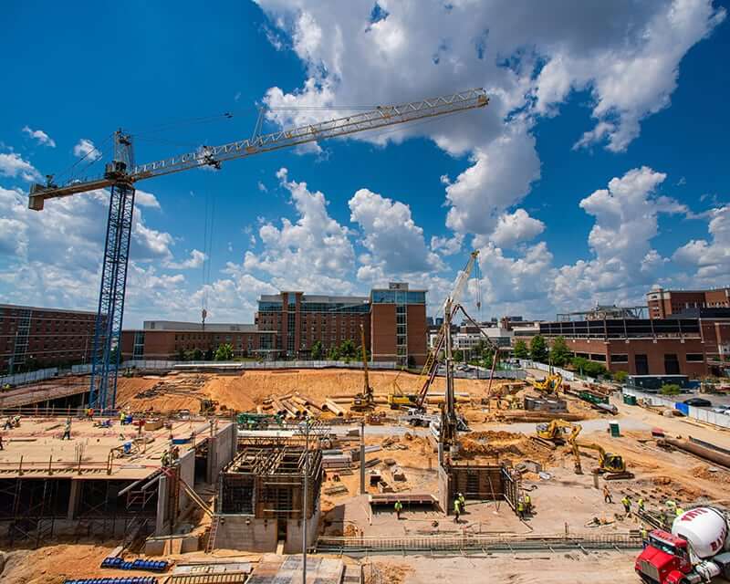 A crane looms over a construction site. 