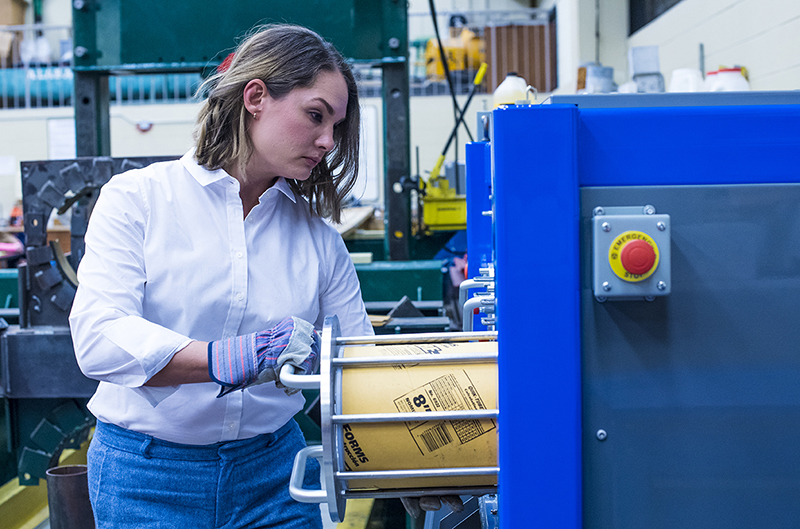 Female engineering student working in a lab. 