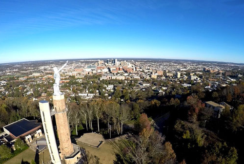 Vulcan atanding above the Birmingham skyline.