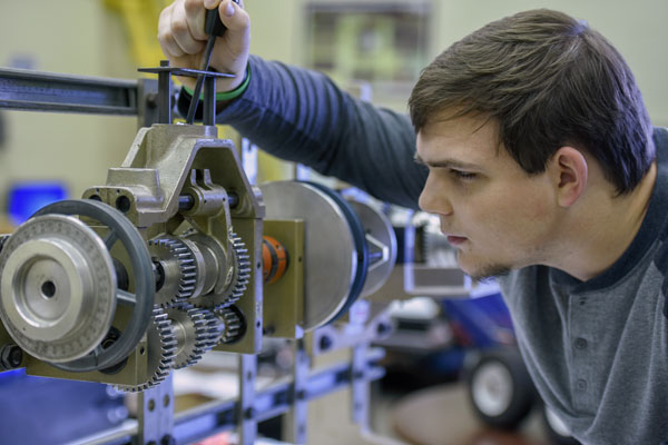 Student using equipment in the lab.