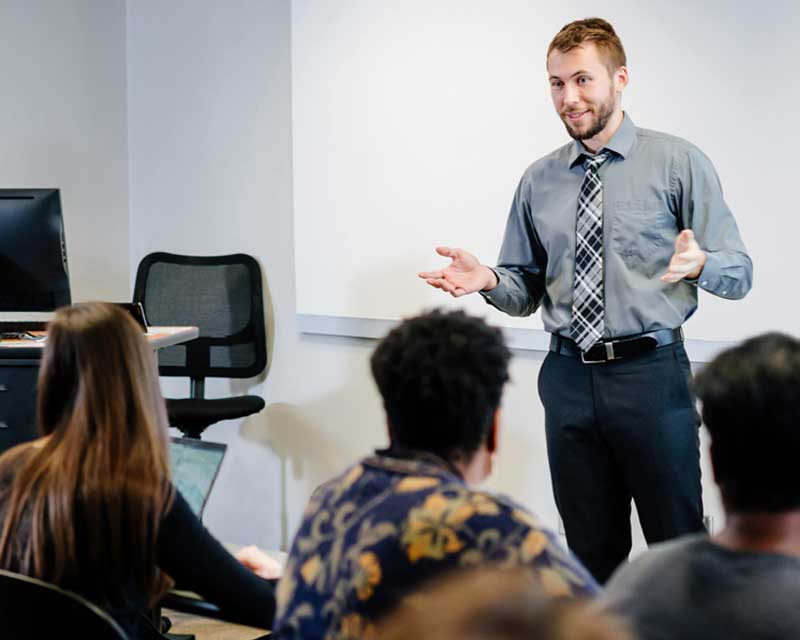 Faculty teaching in a classroom.