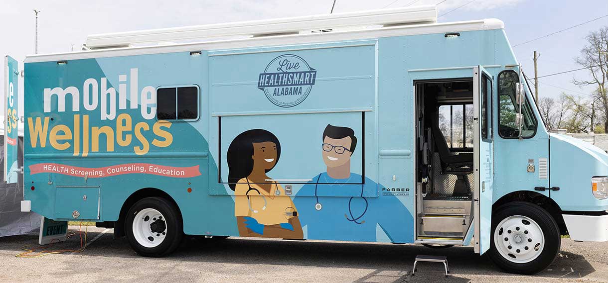 The light blue mobile wellness van.