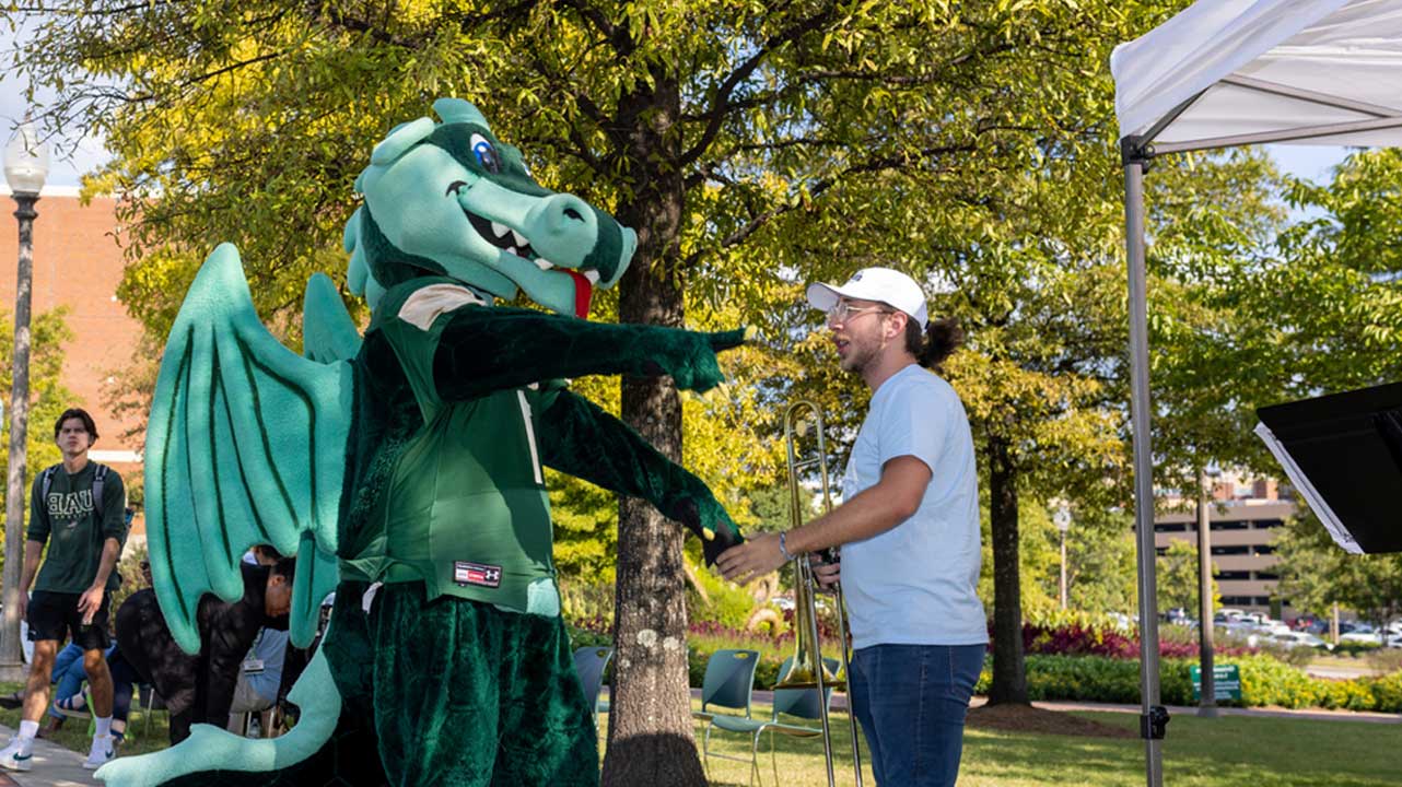 Blaze shaking hands with man.