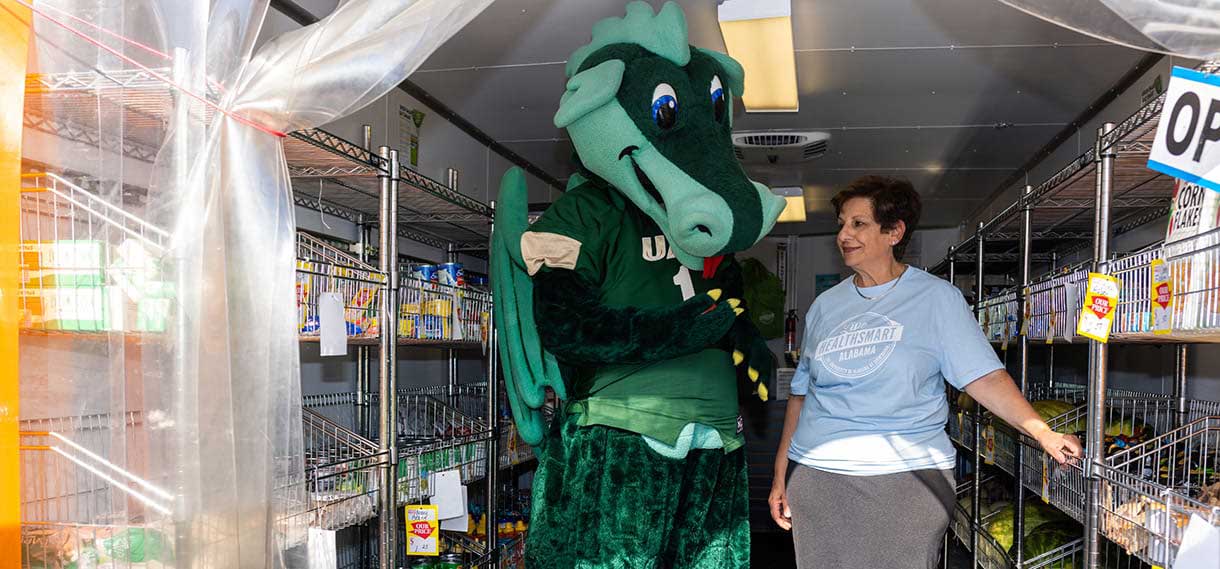 Blaze and Dr. Mona Fouad inside the Mobile Market van.