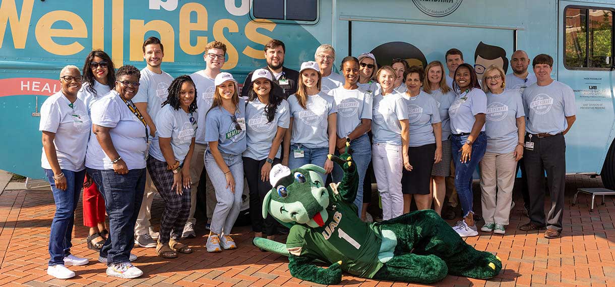 Blaze and volunteers outside the Mobile Wellness van.