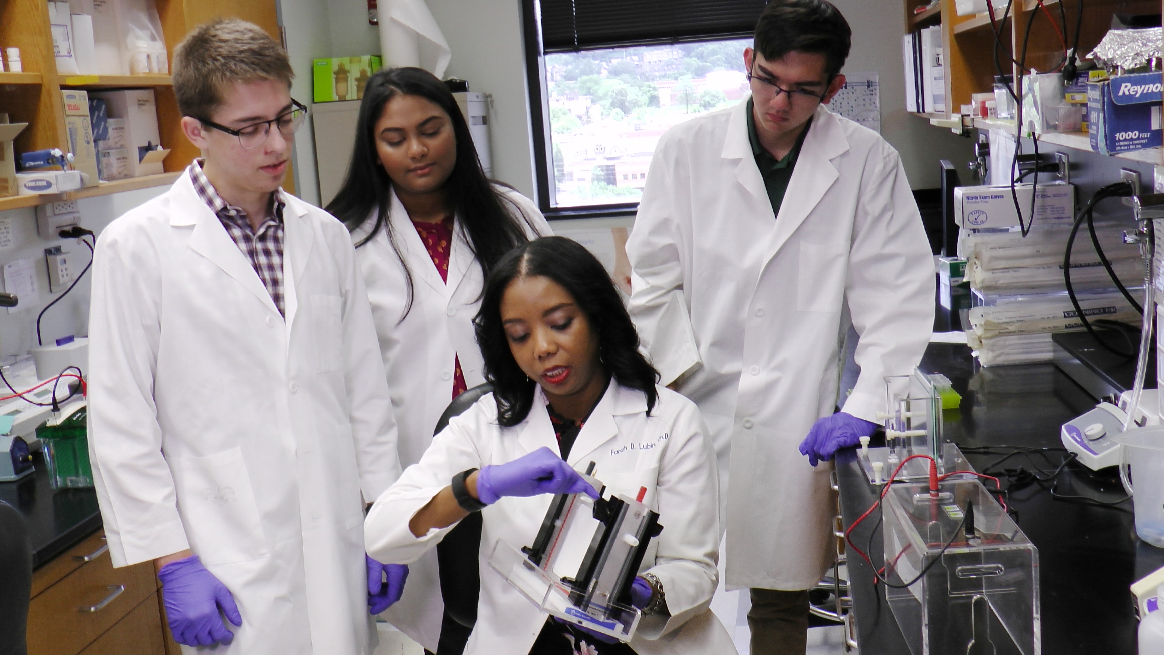 Dr. Farah Lubin (sitting) with members of her research team.