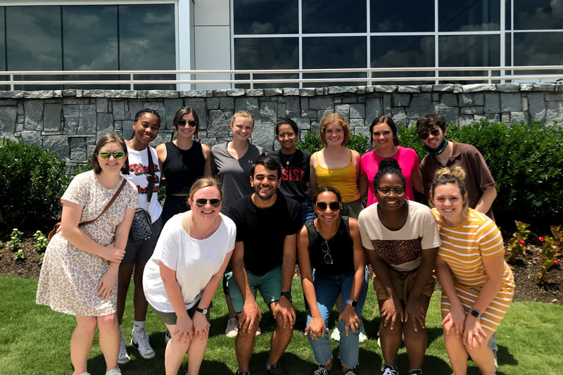 CU2RE students with Urban Underserved and Rural Pathways Director Jill Marsh, M.D., outside of the memorial.