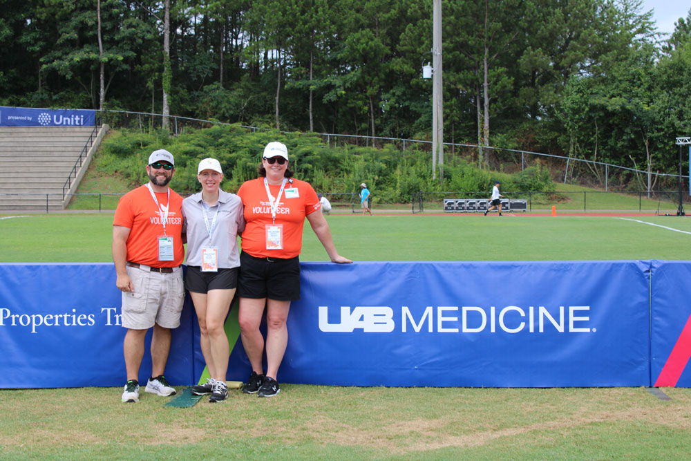 Sara Gould, M.D., MPH, Jennifer Wallace, ATC, and Joel Evans, D.O., at flying disc.