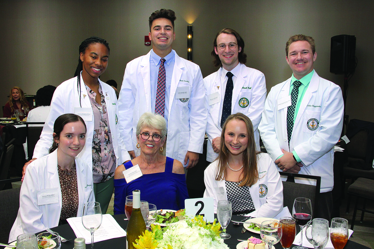 Linda Draughn with Burleson scholarship recipients at the 2022 Scholarship Dinner.
