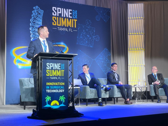 Dr. Jakub Godzik Presenting at Spine Summit 2025