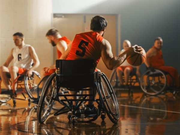 para-athletes playing basketball