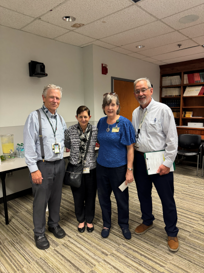 Julie Decker, Tika Benveniste, Ph.D., and two men
