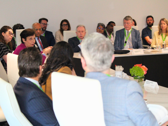 UAB/McM committee members in the ALGEN boardroom discuss global health programs