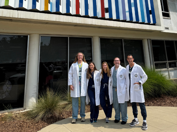Drs. Cole Garrison, Emily Scircle, Elizabeth Van Swol, Tanner Nelson, and Tyler Whitaker outside UAB Hospital-Callahan Eye