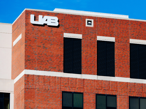 outside looking at top of uab building showing the uab logo