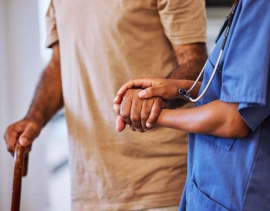 helping a patient with a fall risk