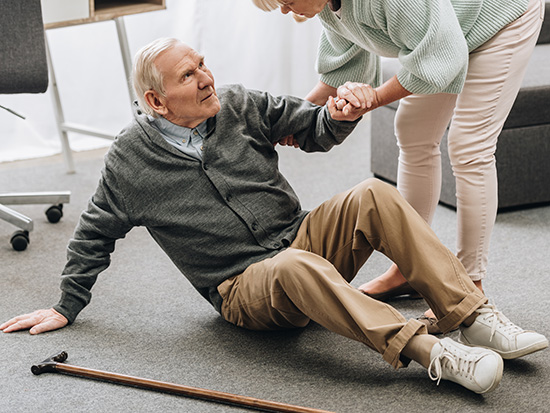 helping a patient with a fall risk