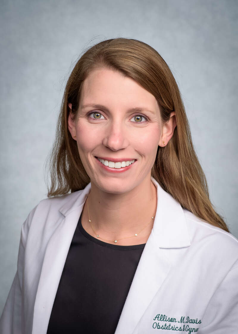 Headshot of Dr. Allison M. Davis, MD (Assistant Professor, OB/GYN - Women's Reproductive Healthcare) in white medical coat, September 2023.
