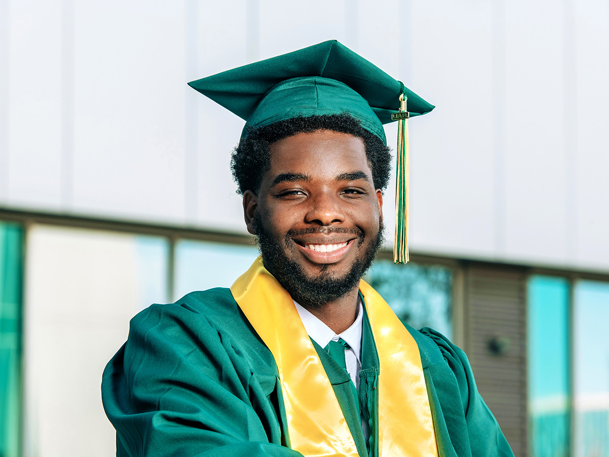 Headshot of Devin Manigault in his commencement regalia. 