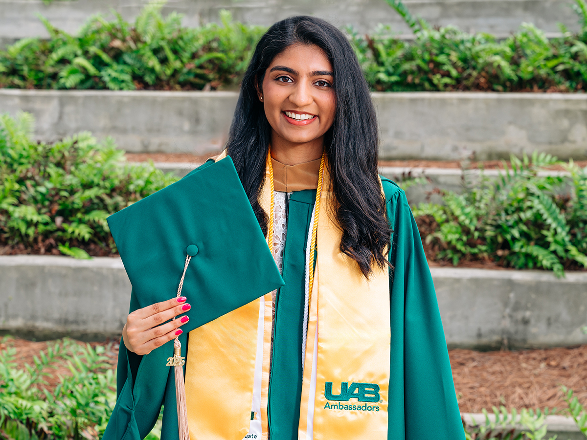 Photo of Anushka Patel in her UAB graduation regaila.