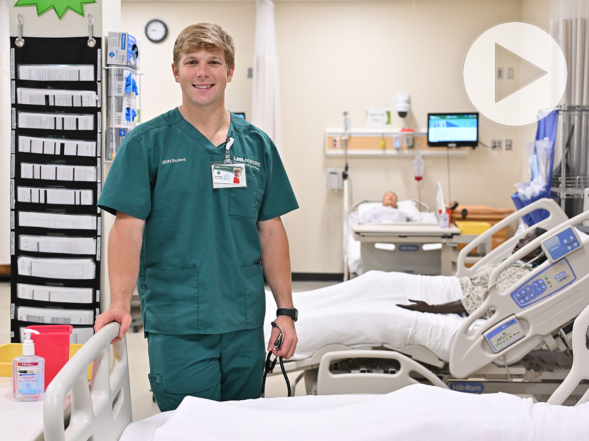 Tyler Waugh in his UAB nursing scrubs.