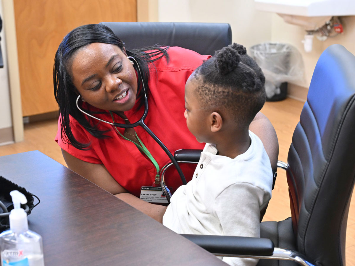 Nurse Practitioner Laken Hilliard performs a checkup to a patient
