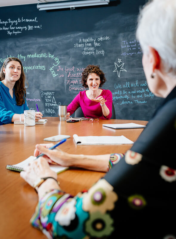 UAB faculty members collaborating around a table. 