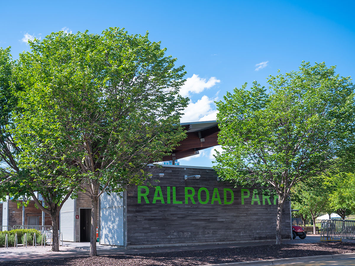 Railroad Park sign surrounded by green trees at Birmingham's Railroad Park