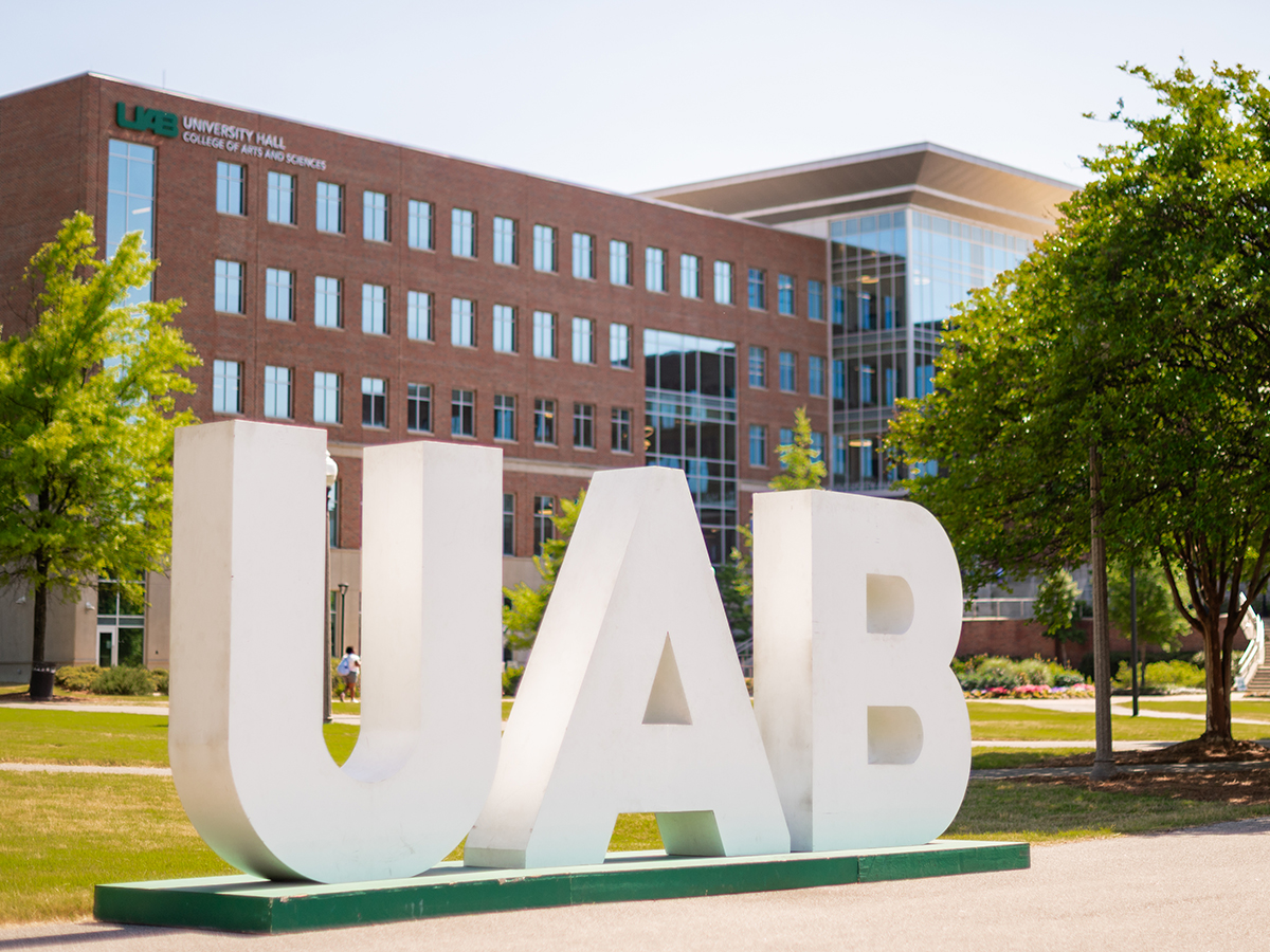 Letters spell U A B in front of University Hall