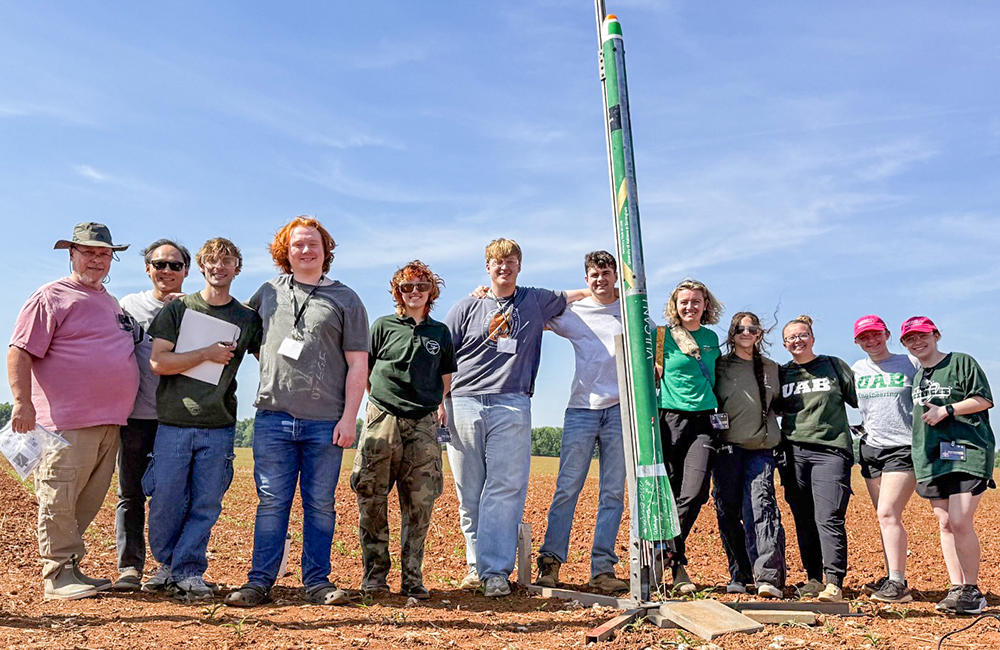 Rocketry Club at UAB group in Huntsville with students, advisors and Vulcan rocket