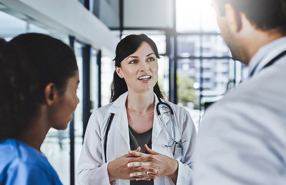 three healthcare providers talking