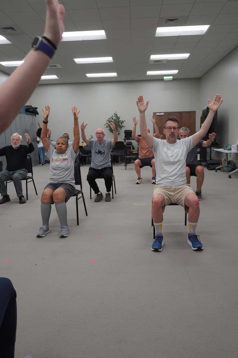 Vanessa Kaczmarek instructs the class to strike a specific stretch