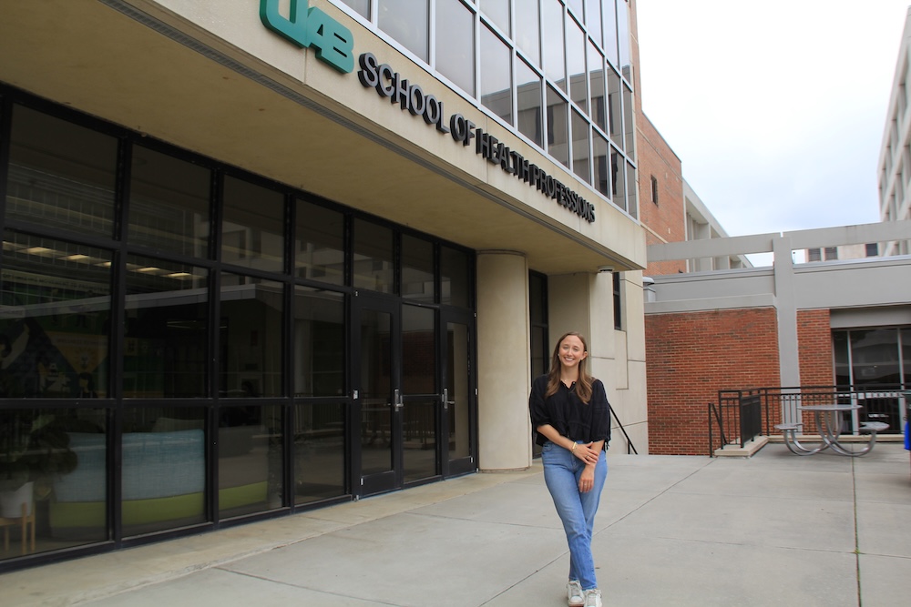 Ellie Prados posed in front of SHPB's University Boulevard entrance