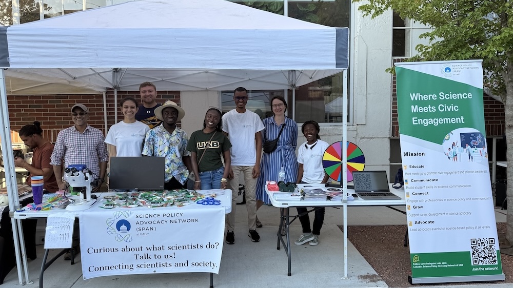 SPAN team posed in their booth at Pepper Place.
