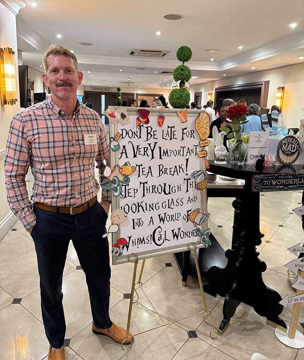 Dr Jason Vice welcomes conference attendees to a reception.